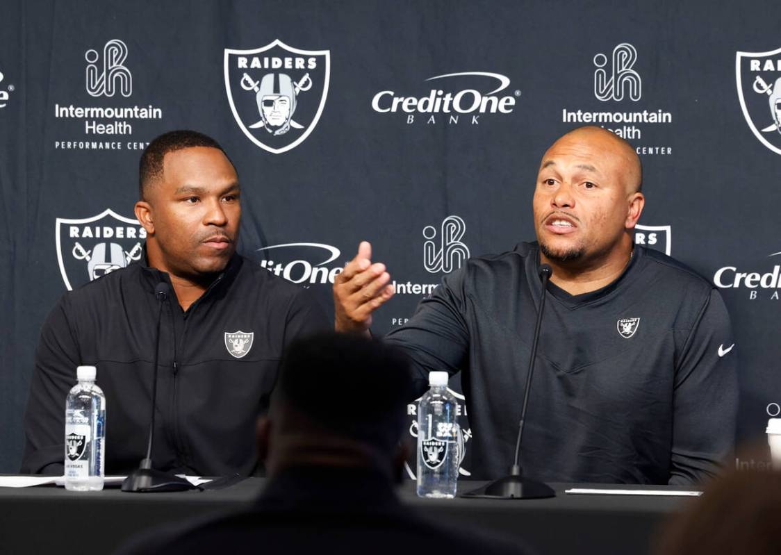 Antonio Pierce, Raiders interim head coach, right, speaks during the press conference as Champ ...