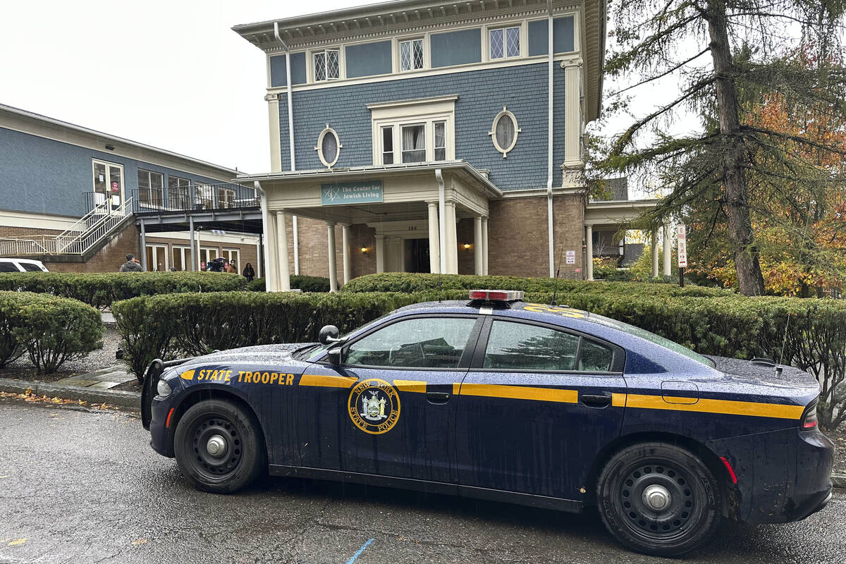 A New York State Police Department cruiser is parked in front of Cornell University's Center fo ...