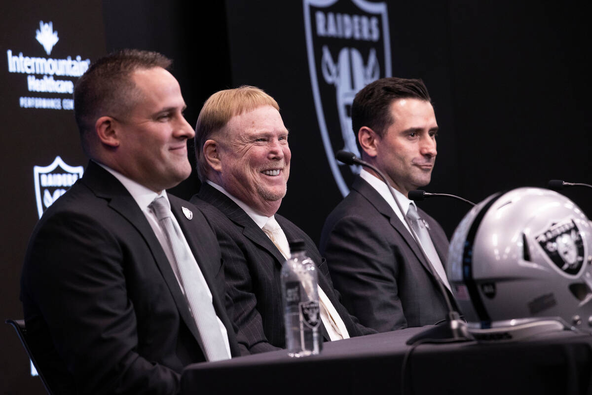 Raiders head coach Josh McDaniels, left, Raiders owner Mark Davis and Raiders general manager D ...