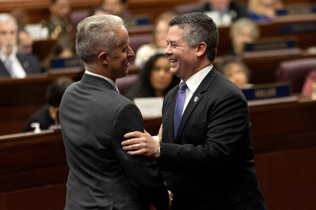 Assemblymen Toby Yurek, R-Henderson, left, and Steve Yeager, D-Las Vegas, greet each other as t ...