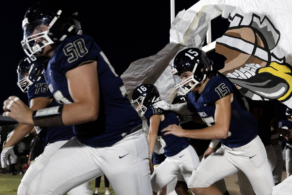 Lake Mead, including siblings Gracie Rhodes (16) and Gavin Rhodes (15) take the field for their ...