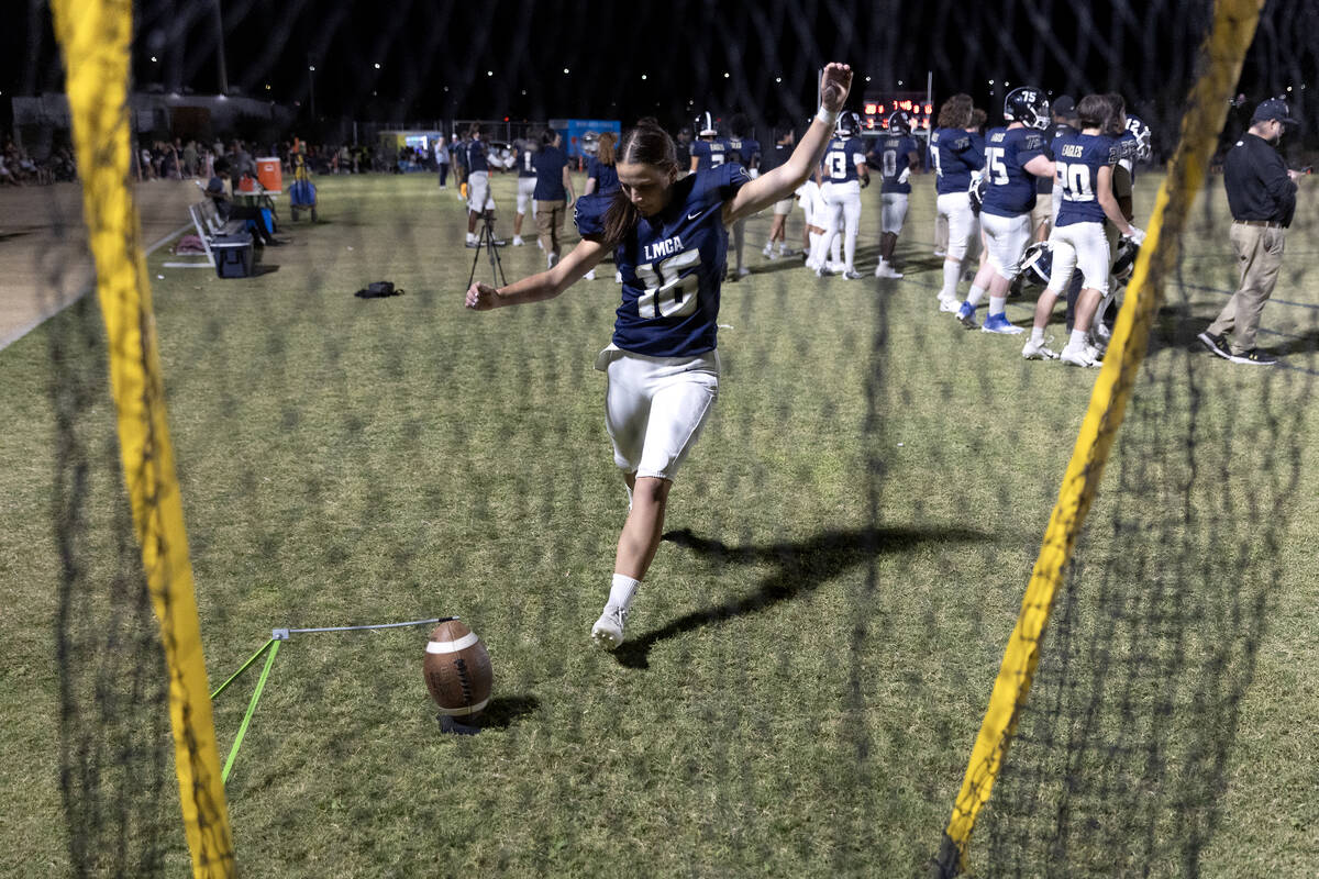 Kicker Gracie Rhodes warms up while her team plays offense against Lincoln County during a Clas ...