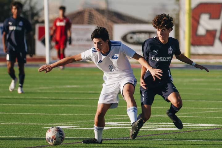 Bishop Gorman defender Andrew Sanchez (2) and Coronado midfielder Dalton Meusy (6) chase after ...