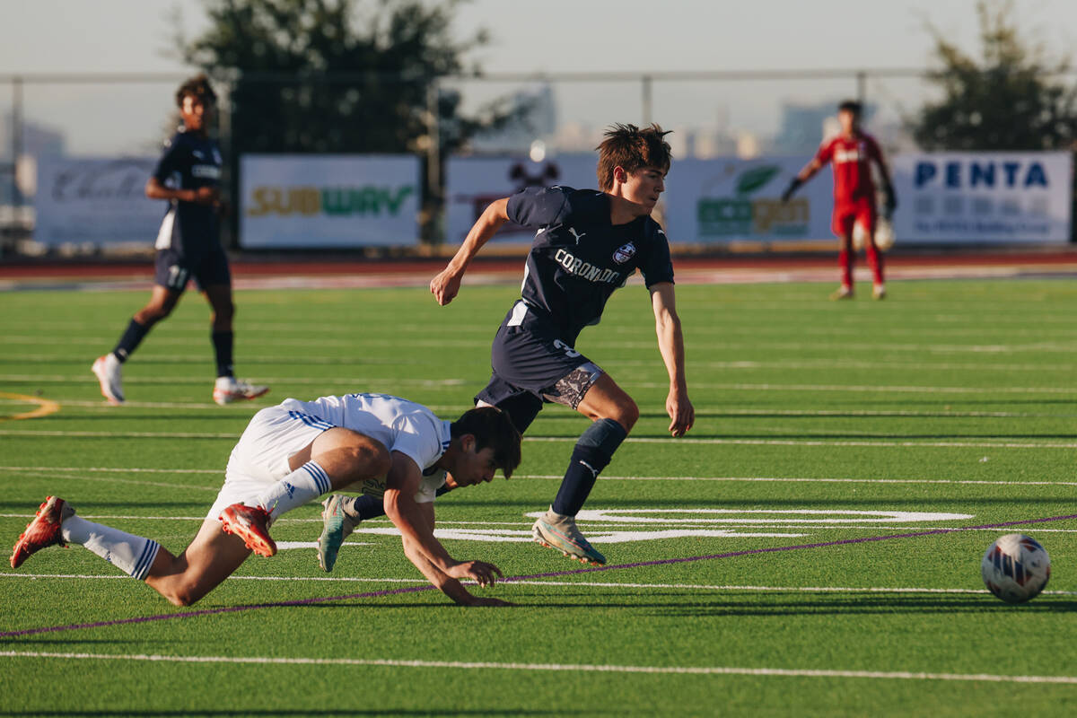 Coronado’s Grayson Elisaldez (3) and Bishop Gorman’s Alexander Rogers (20) chase ...