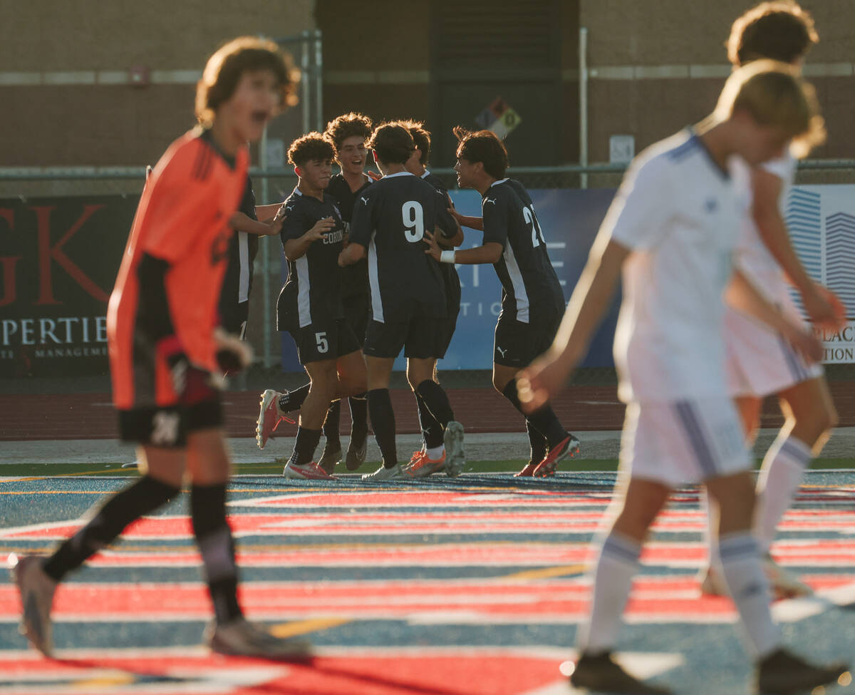 Bishop Gorman players walk by Coronado players celebrating a goal during a Class 5A Southern Le ...