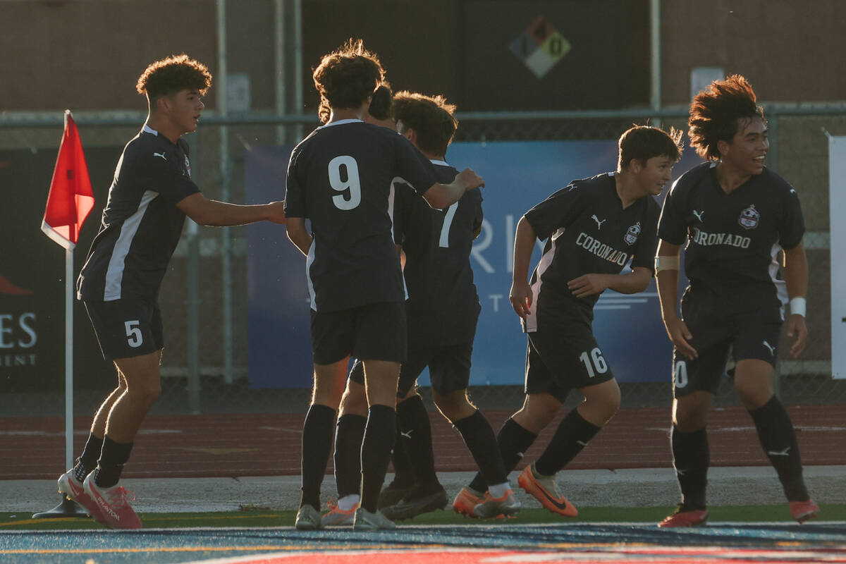 Coronado players celebrate scoring a goal against Bishop Gorman during a Class 5A Southern Leag ...