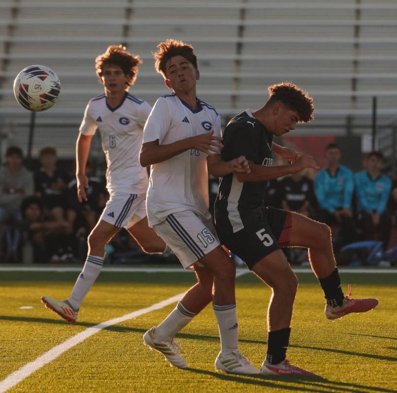 Coronado midfielder Dylan Flores (5) and Bishop Gorman’s Massimiliano Musi (15) bump int ...