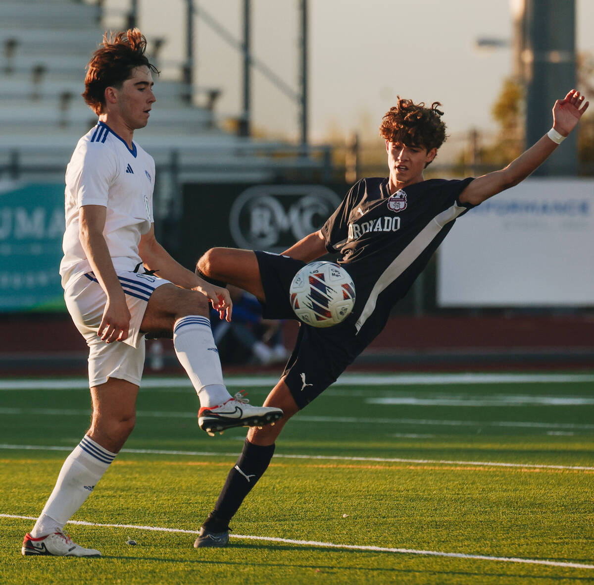 Coronado midfielder Dalton Meusy (6) fights for the ball as Bishop Gorman’s Luke Parker ...