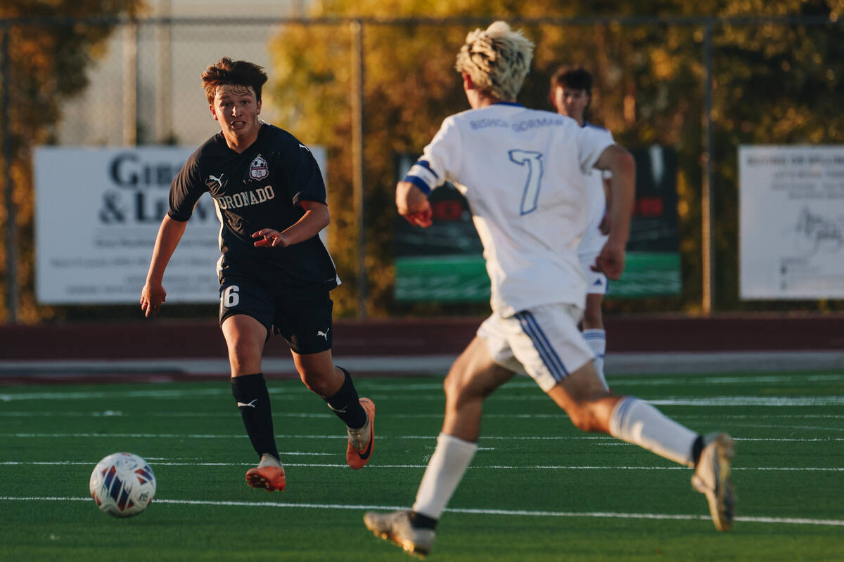 Coronado’s Aiden Sent kicks the ball as Bishop Gorman’s Maddix Bordinhao (7) clos ...