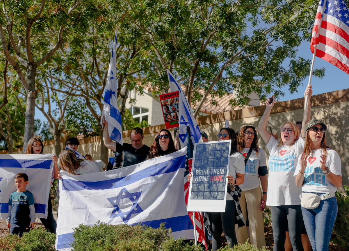Pro-Israel demonstrators gather in response to graffiti written on a wall in a neighborhood the ...