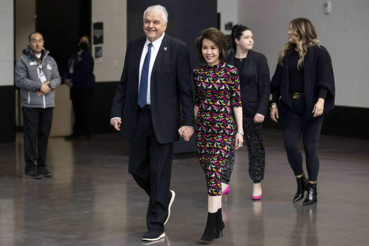 Nevada Gov. Steve Sisolak, from left; his wife, Kathy; and daughters Ashley and Carley enter Al ...