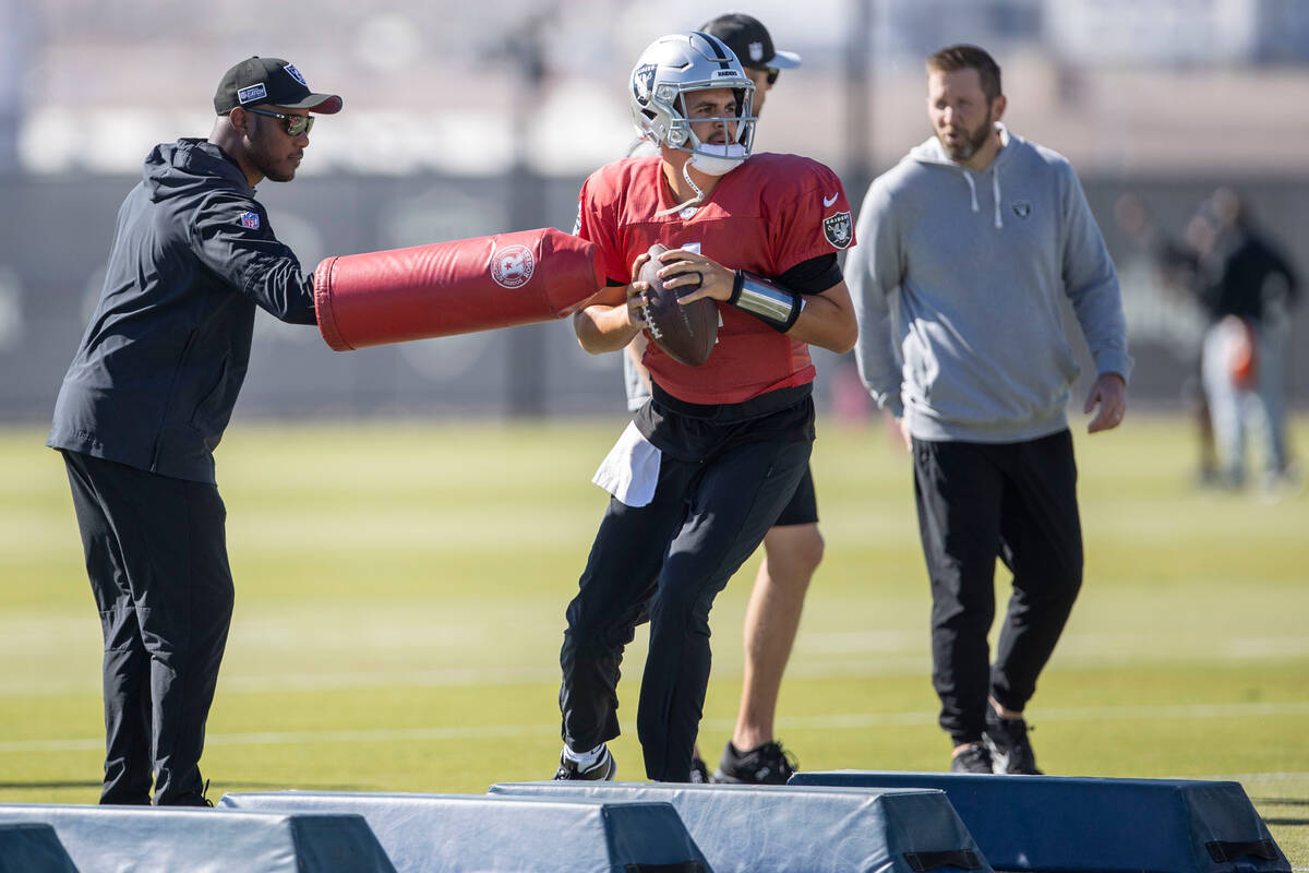 Raiders quarterback Aidan O'Connell (4) prepares to throw during practice at the Intermountain ...