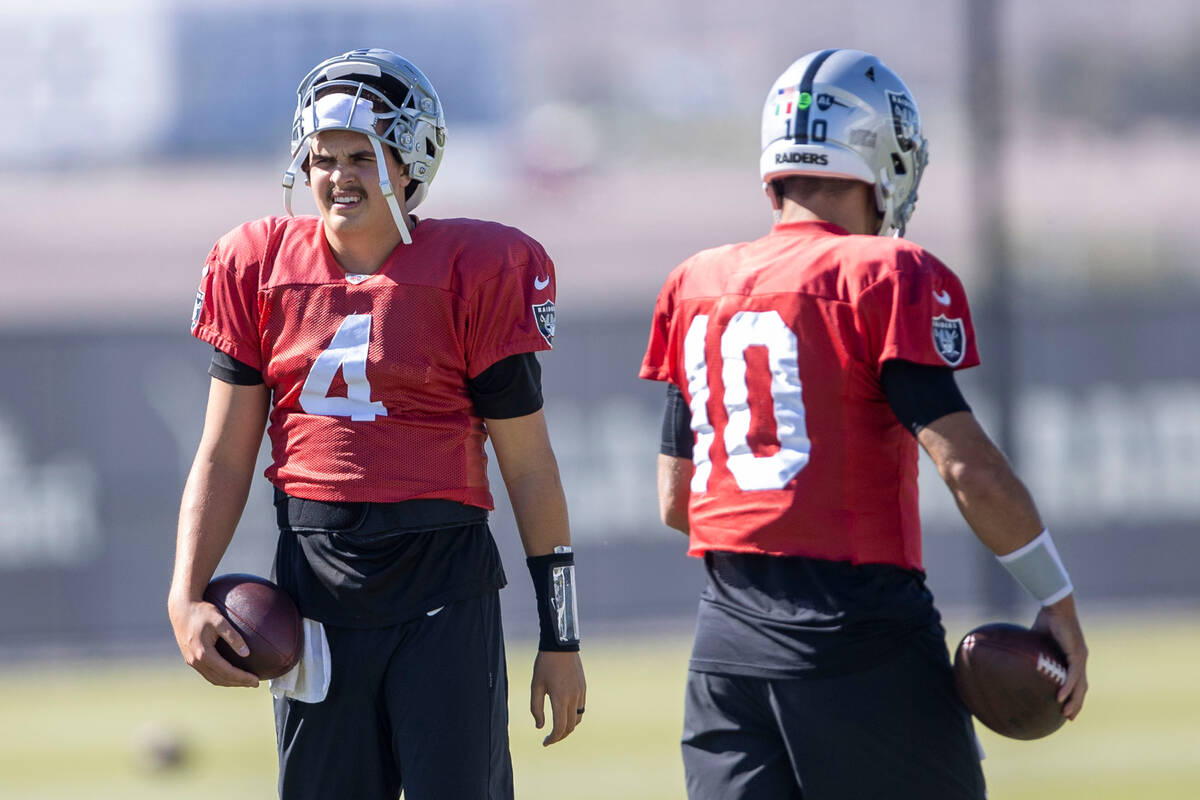 Raiders quarterback Aidan O'Connell (4) and quarterback Jimmy Garoppolo (10) work through drill ...