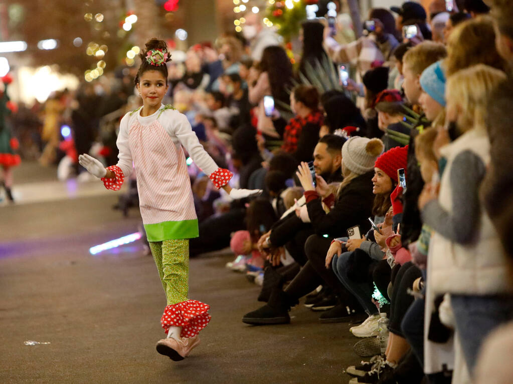 A dancer performs during the holiday parade at Downtown Summerlin on Friday, Dec. 3, 2021, in L ...