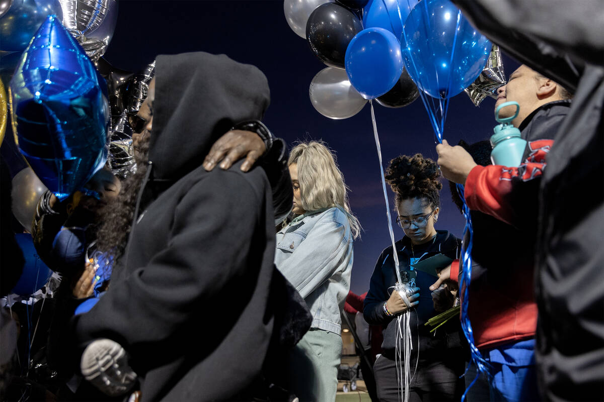 Loved ones of Desert Pines High School football player, Se’Mauri Norris-Johnson, gather ...