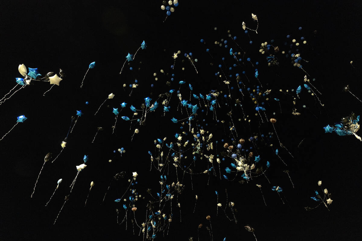 Balloons are release in honor of Desert Pines High School football player, Se’Mauri Norr ...