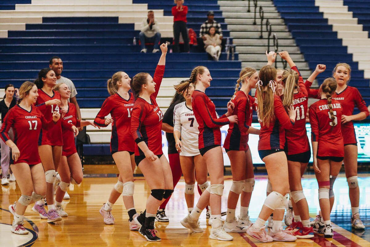 The Coronado girls volleyball team celebrates winning a match against Shadow Ridge during a Cla ...