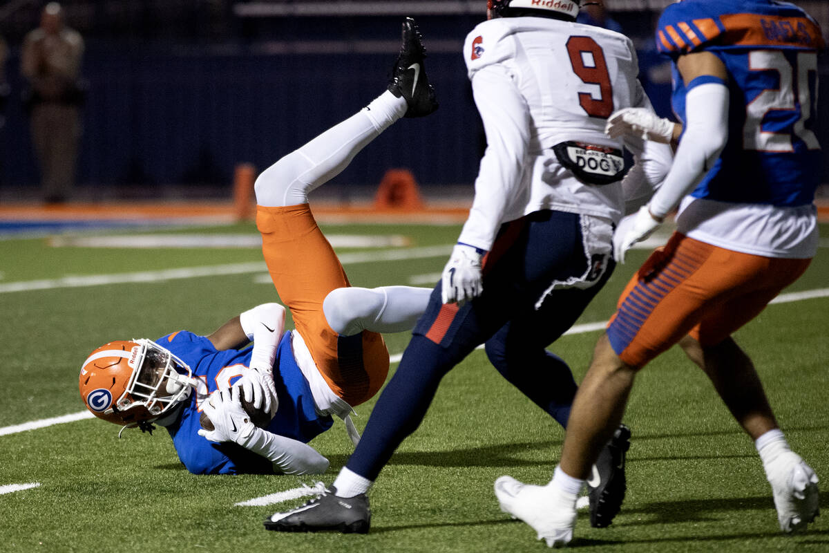 Bishop Gorman defensive back Jett Washington (5) catches an interception during the first half ...