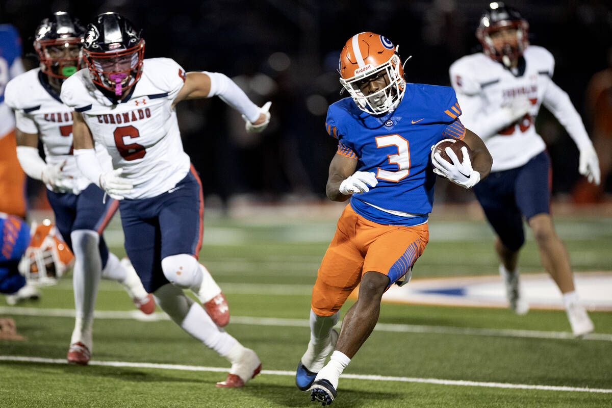 Bishop Gorman running back Devon Rice (3) carries the ball up the field followed by Coronado de ...