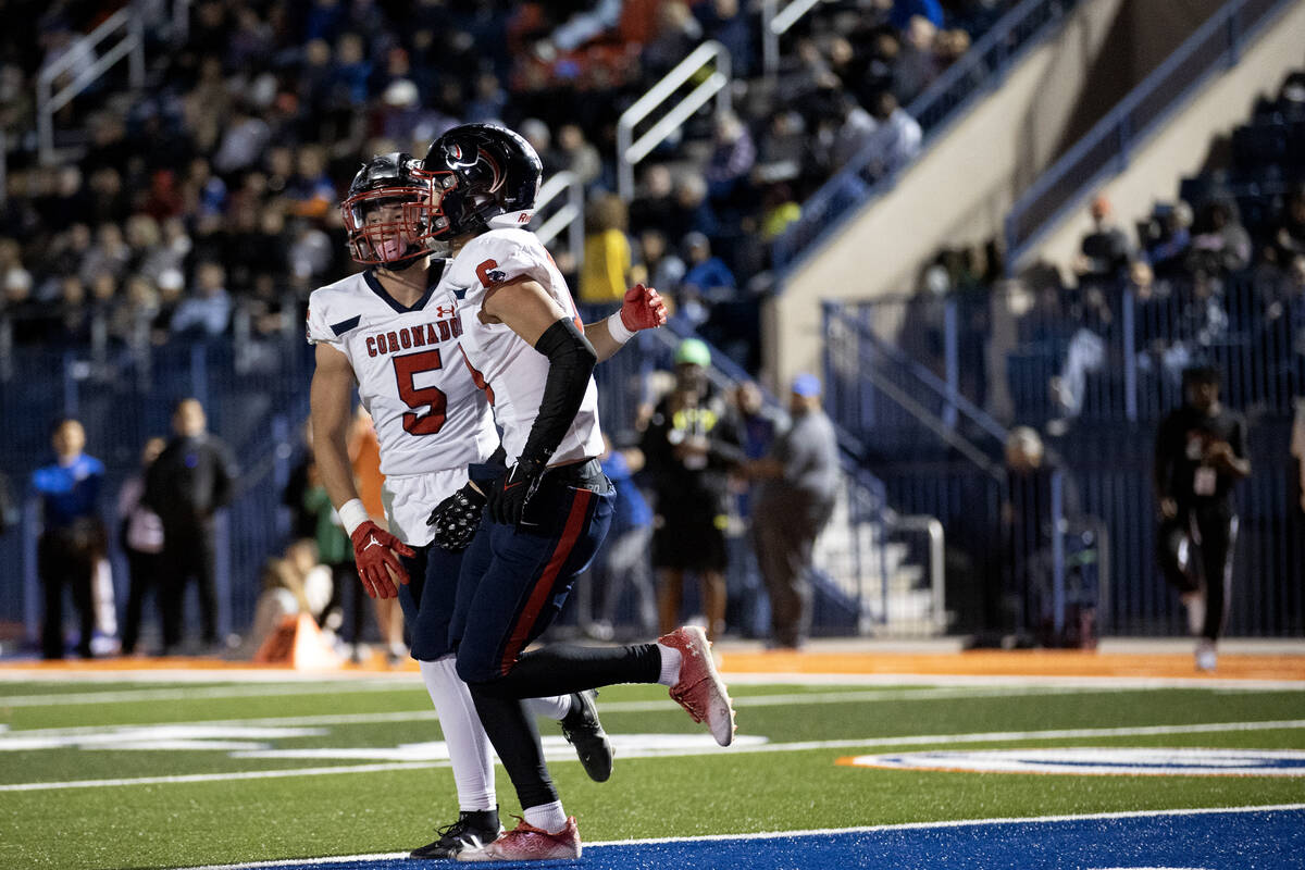 Coronado running back Derek Hurley (5) and wide receiver Scott Holper (13) celebrate Holper&#x2 ...