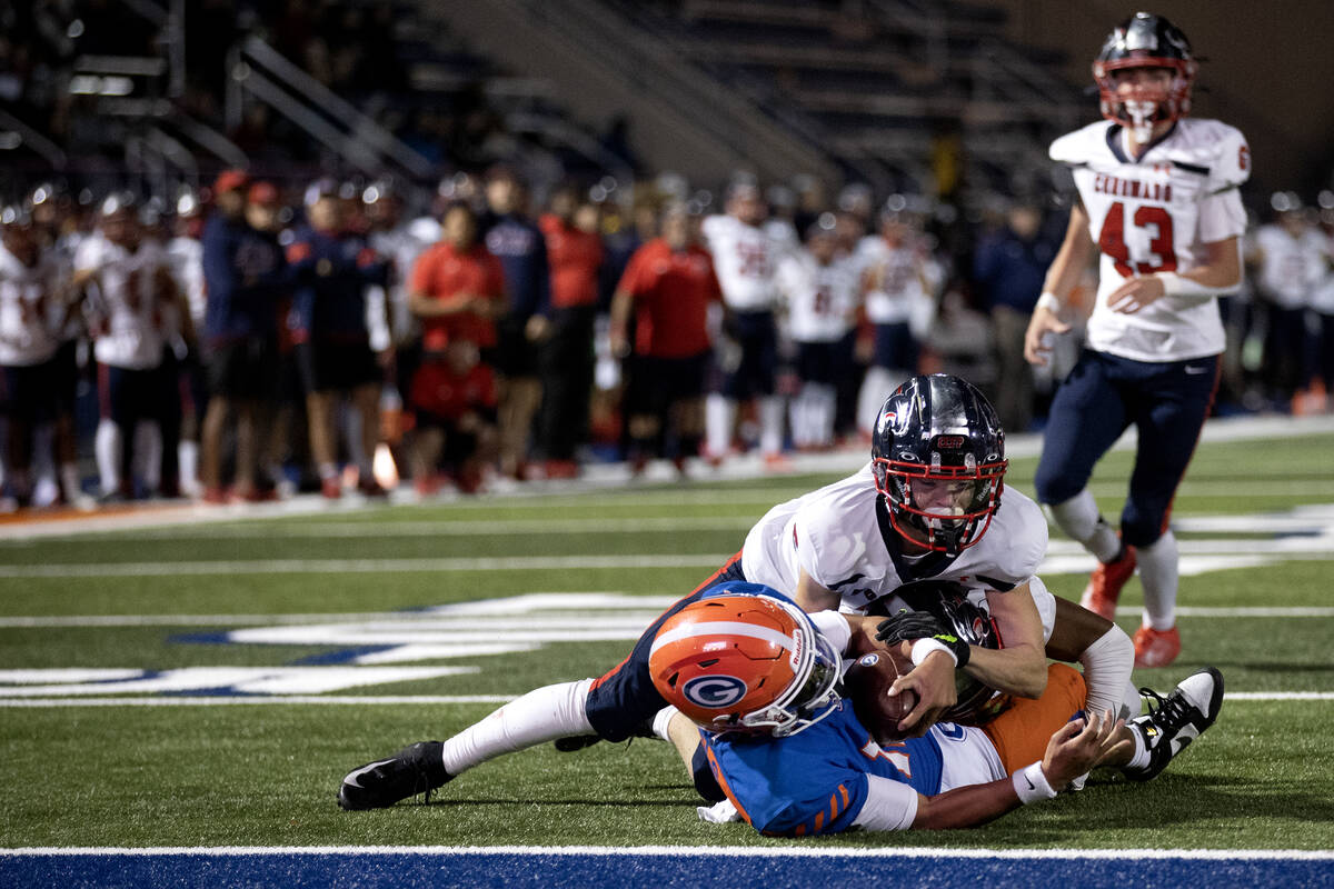 Coronado defensive back Ricky Edwards (2) tackles Bishop Gorman running back Myles Norman (24) ...