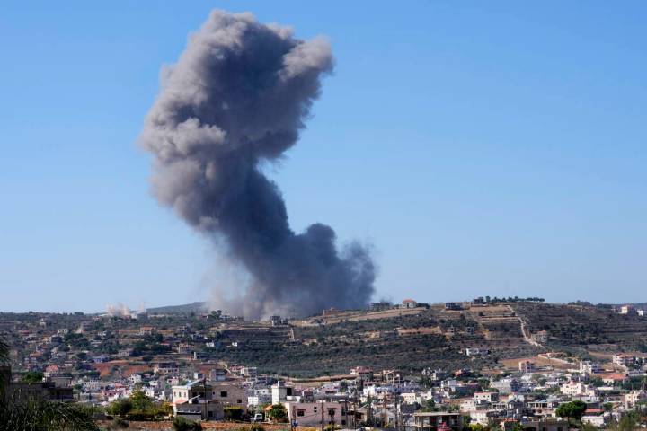 Black smoke rises from an Israeli airstrike on the outskirts of Aita al-Shaab, a Lebanese borde ...