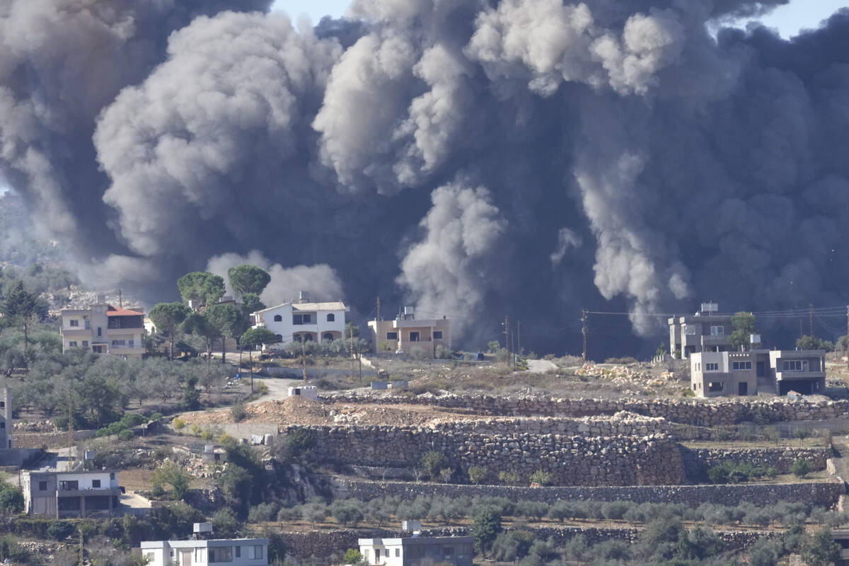 Black smoke rises from an Israeli airstrike on the outskirts of Aita al-Shaab, a Lebanese borde ...