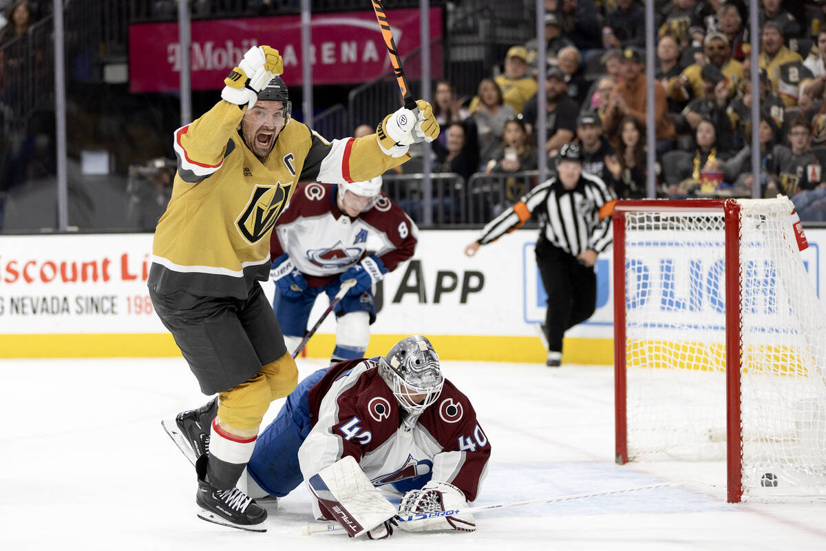 Golden Knights right wing Mark Stone (61) celebrates as he scores on Avalanche goaltender Alexa ...