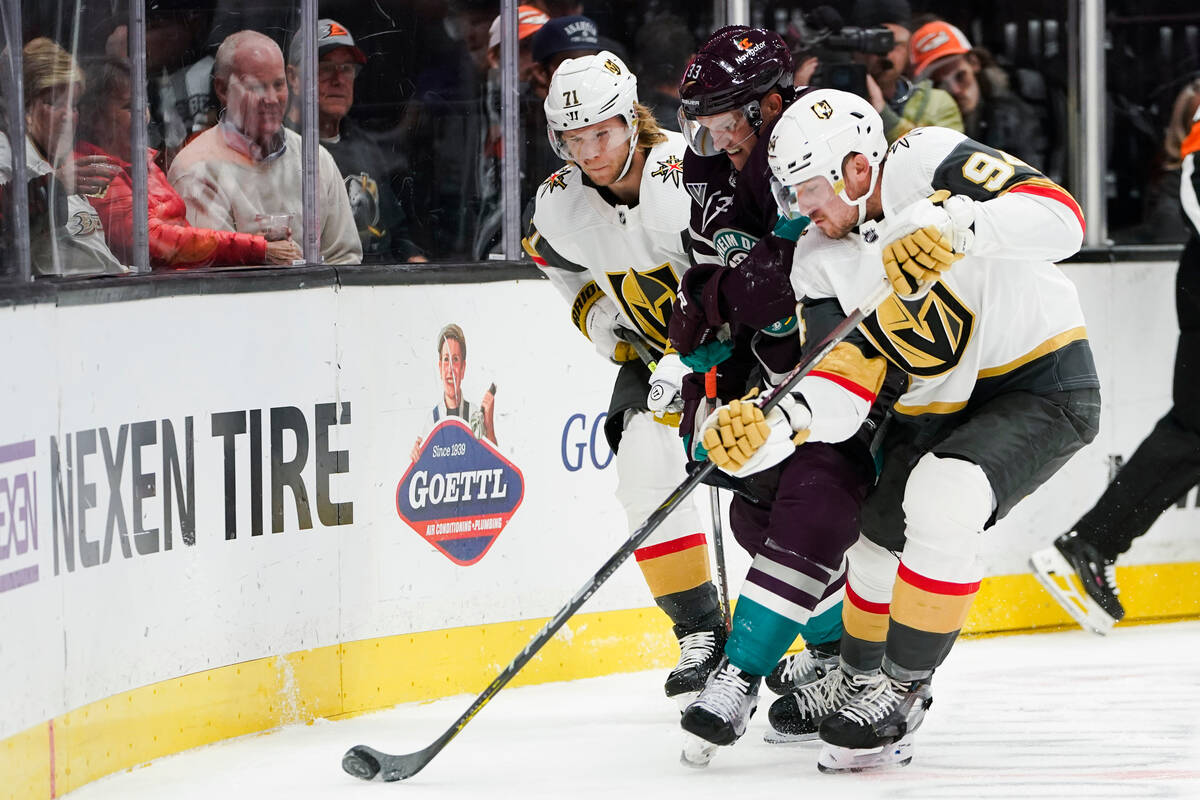 Anaheim Ducks right wing Jakob Silfverberg, center, vies for the puck with Vegas Golden Knights ...