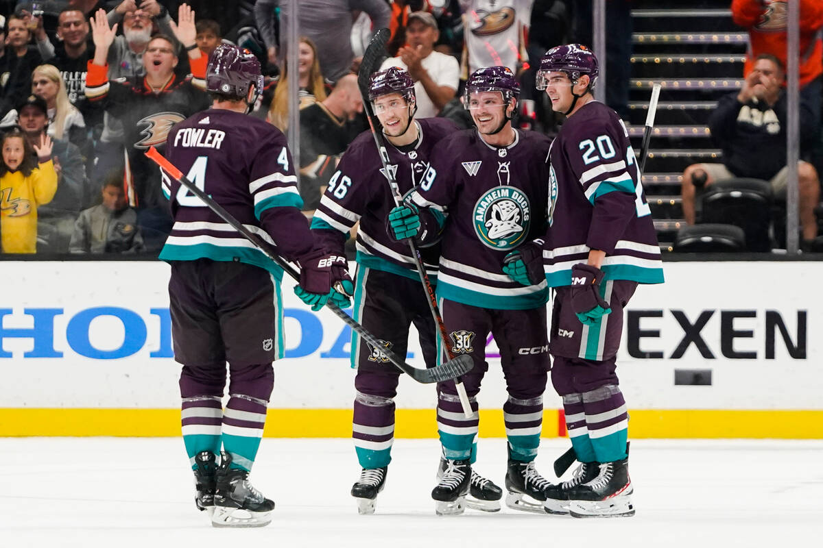 Anaheim Ducks center Sam Carrick, second from right, celebrates after his goal with defenseman ...