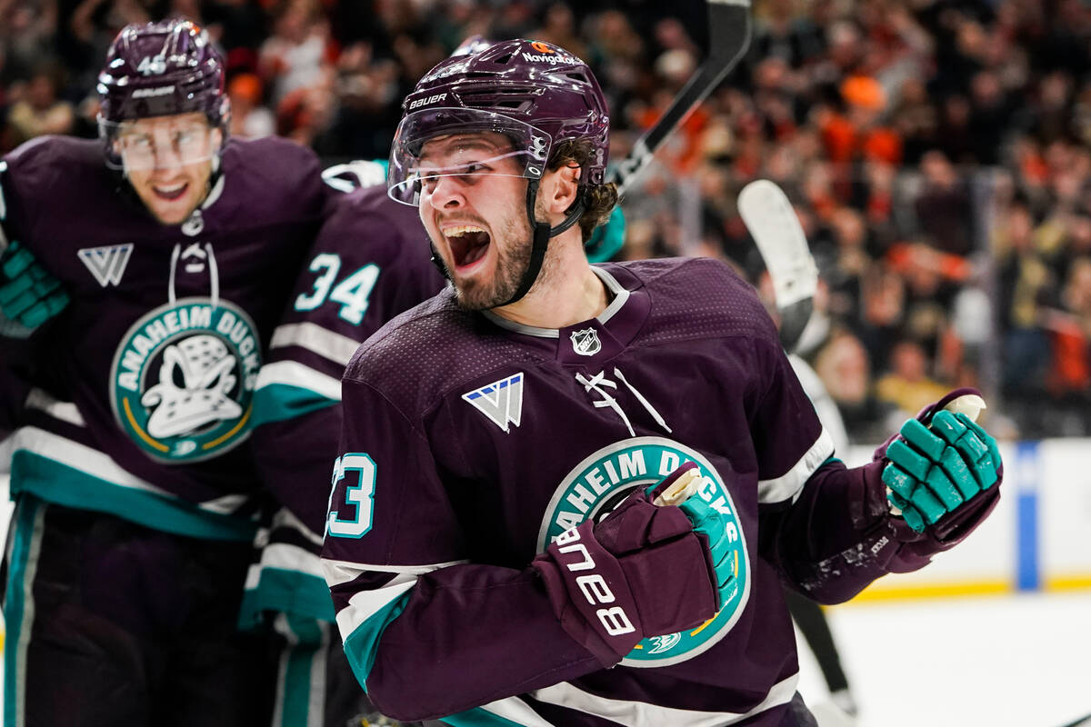 Anaheim Ducks center Mason McTavish, front, reacts after scoring during the third period of an ...