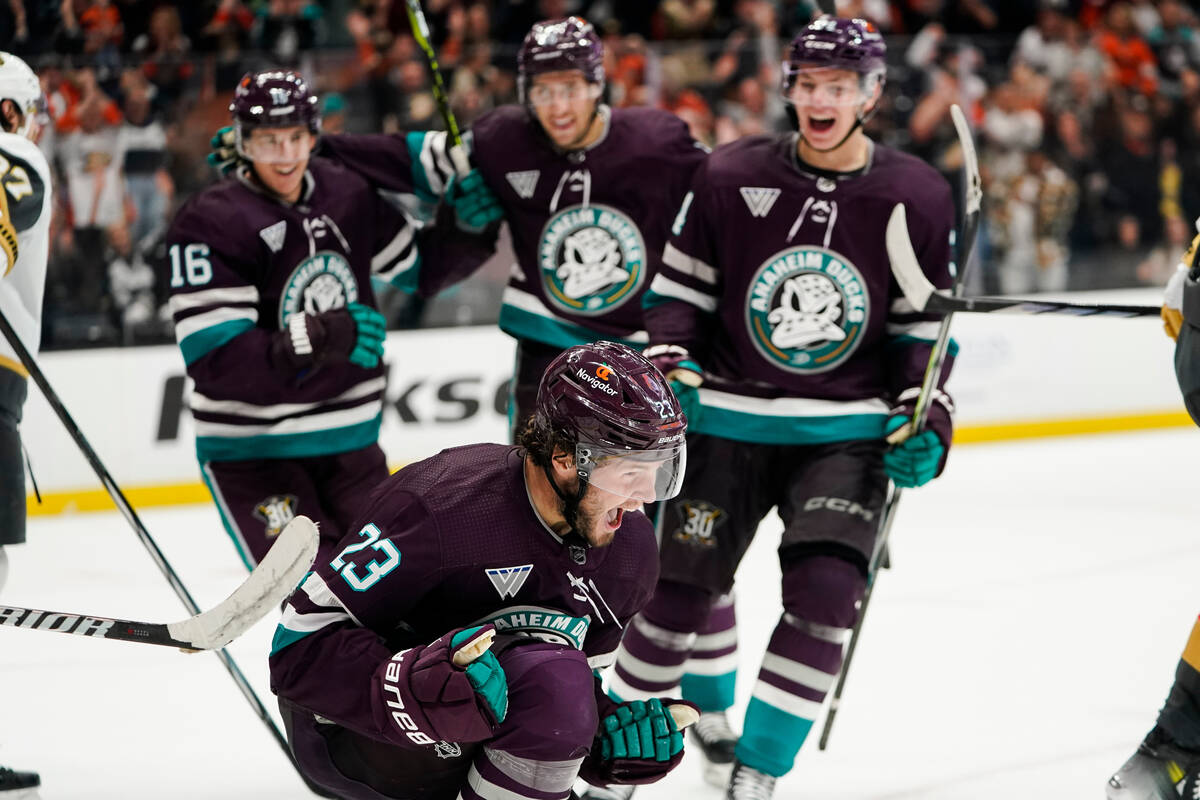 Anaheim Ducks center Mason McTavish, bottom, reacts after scoring during the third period of an ...