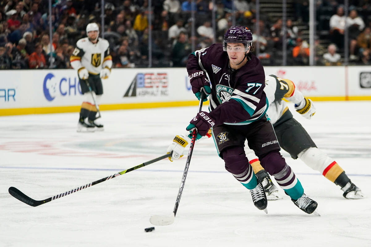 Anaheim Ducks right wing Frank Vatrano (77) controls the puck ahead of Vegas Golden Knights cen ...