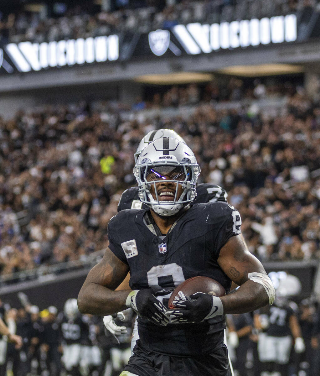 Raiders running back Josh Jacobs (8) celebrates a touchdown against the New York Giants during ...