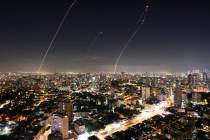 Israeli Iron Dome air defense system fires to intercept a rocket fired from the Gaza Strip, in ...