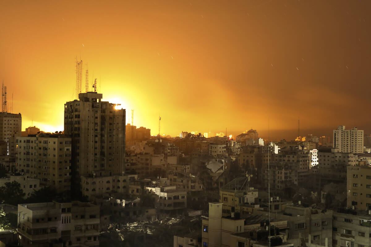 Fire and smoke rises from buildings following Israeli airstrikes on Gaza City, Sunday, Nov. 5, ...