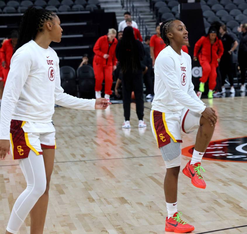 Spring Valley High basketball star Aaliyah Gayles, right, warms up with her USC teammates befor ...