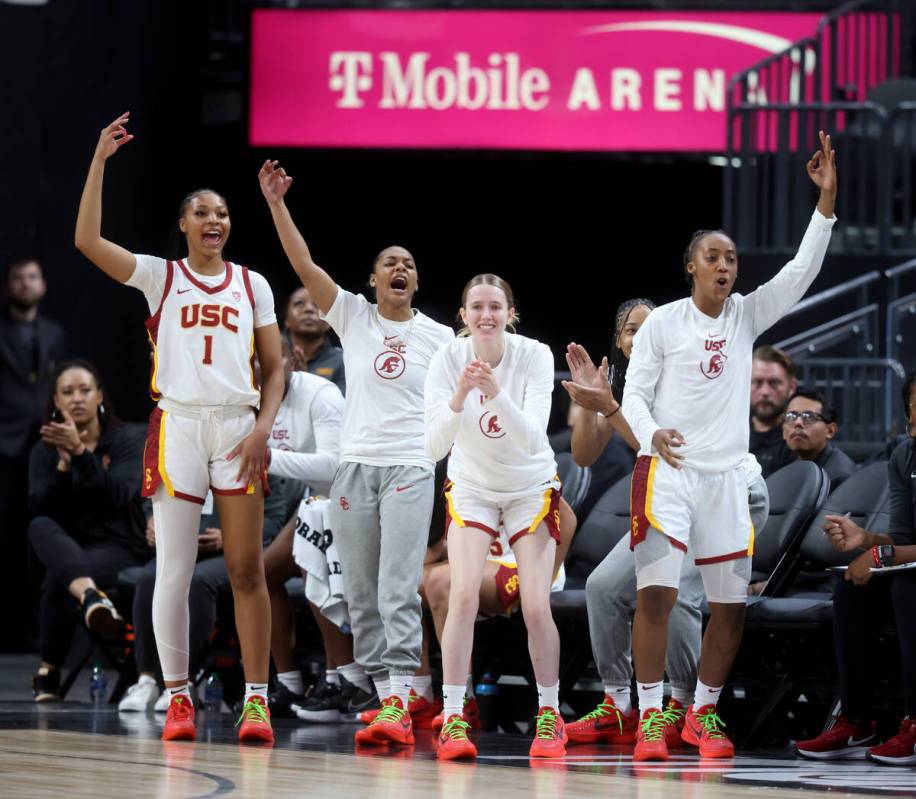 Former Spring Valley High basketball star Aaliyah Gayles, right, cheers with her USC teammates ...