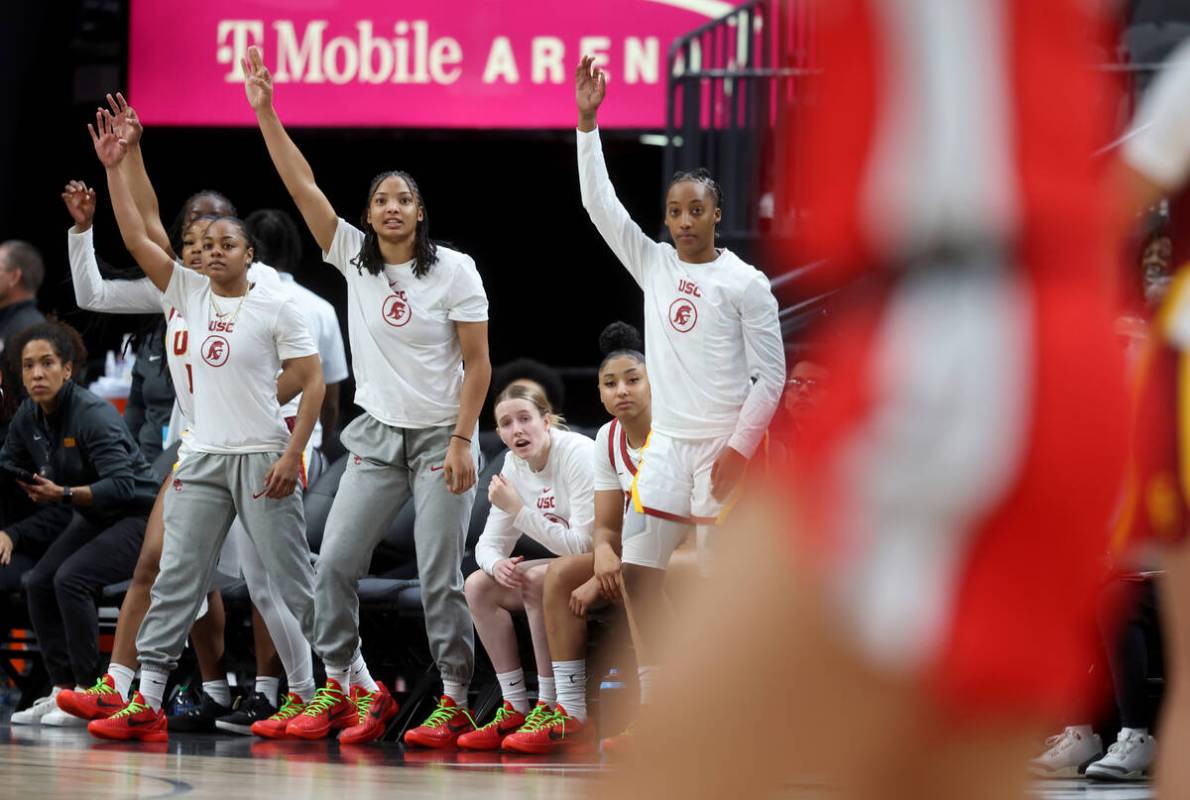 Former Spring Valley High basketball star Aaliyah Gayles, right, cheers with her USC teammates ...