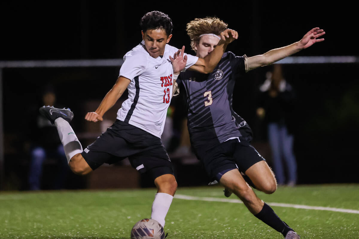 Southeast Career Technical Academy’s Omar Ibarra (13) and Faith Lutheran’s Kade C ...