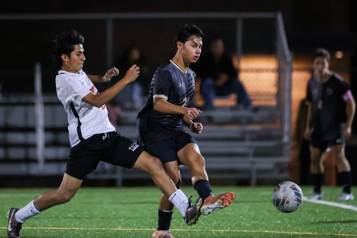 Southeast Career Technical Academy’s Omar Ibarra (13) and Faith Lutheran’s Dmitri ...