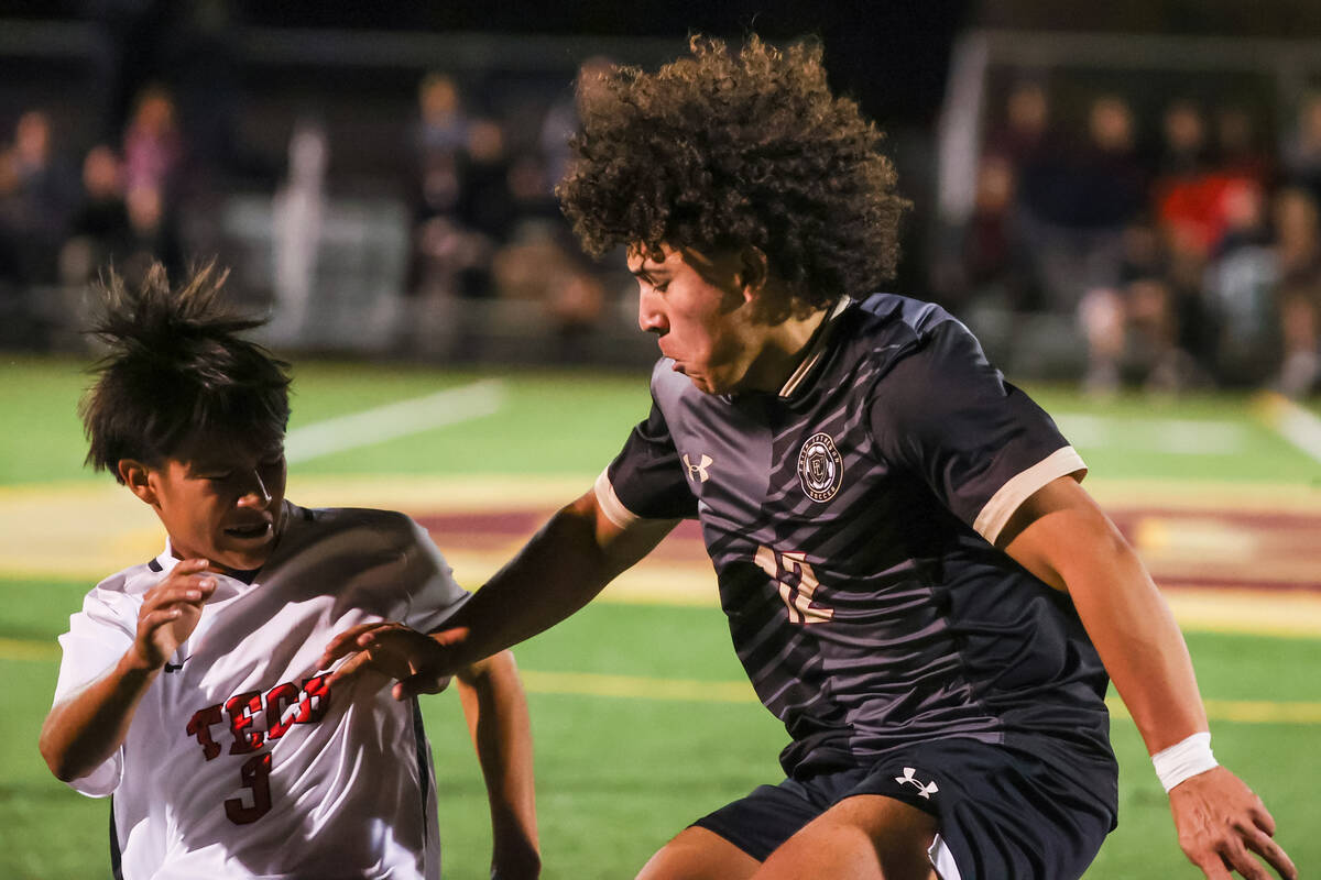 Faith Lutheran’s Cameron Sullivan (12) pushes past Southeast Career Technical Academy&#x ...