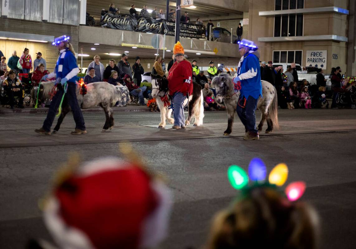 Ponies are part of the parade at Henderson's annual WinterFest in 2019 in Henderson. (Ellen Sch ...