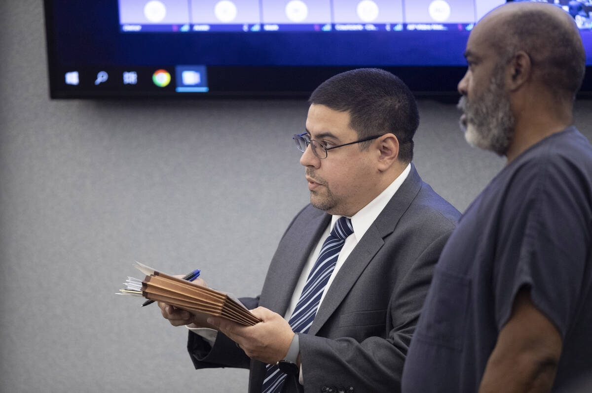 Defense attorney Robert Arroyo (L) stands by Duane Keith “Keffe D” Davis as Davis ...