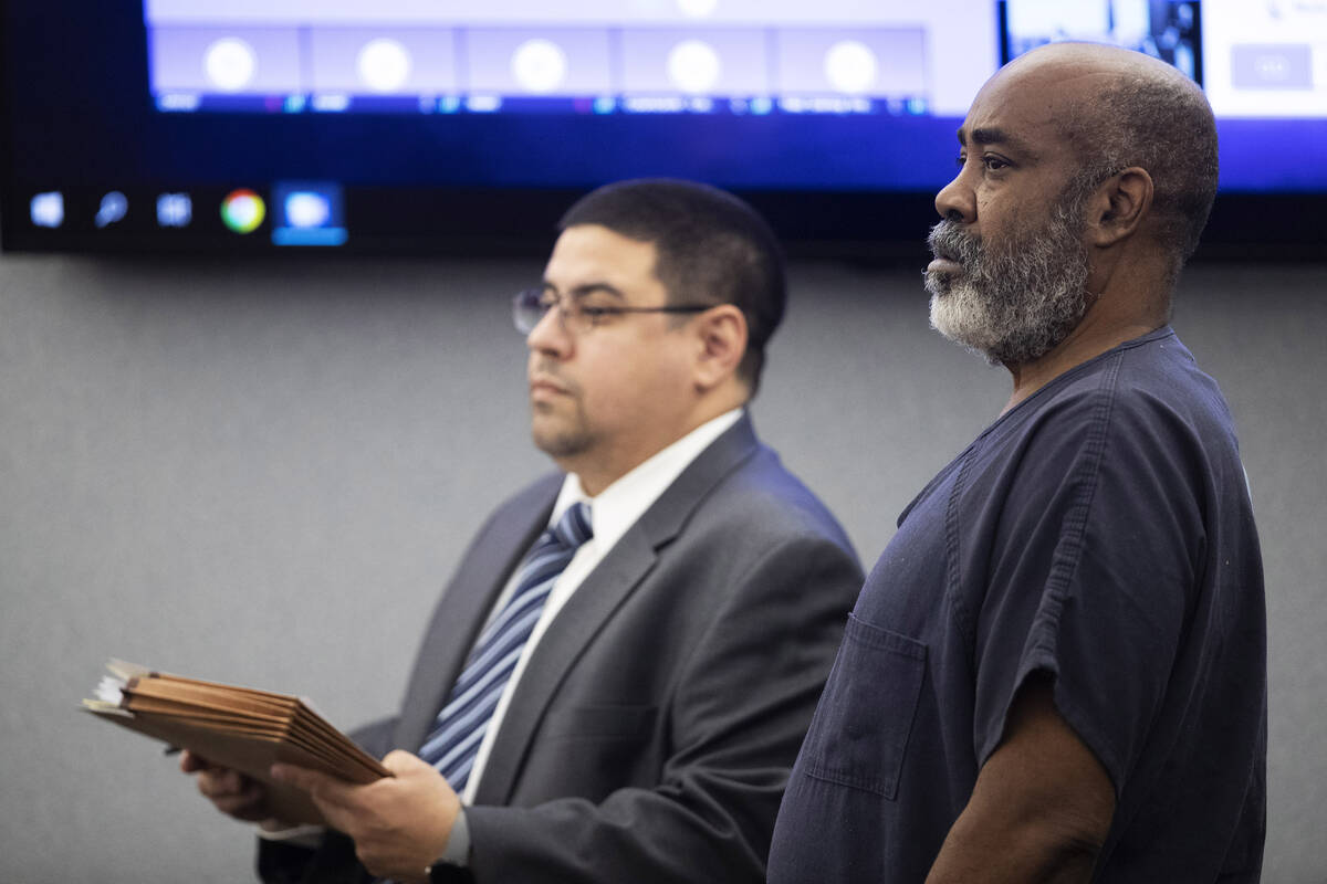 Defense attorney Robert Arroyo (L) stands by Duane Keith “Keffe D” Davis as Davis ...