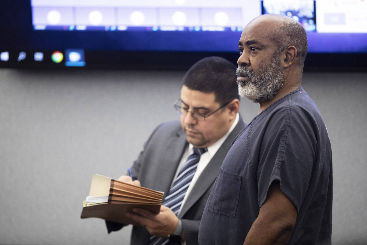 Defense attorney Robert Arroyo (L) stands by Duane Keith “Keffe D” Davis as Davis ...