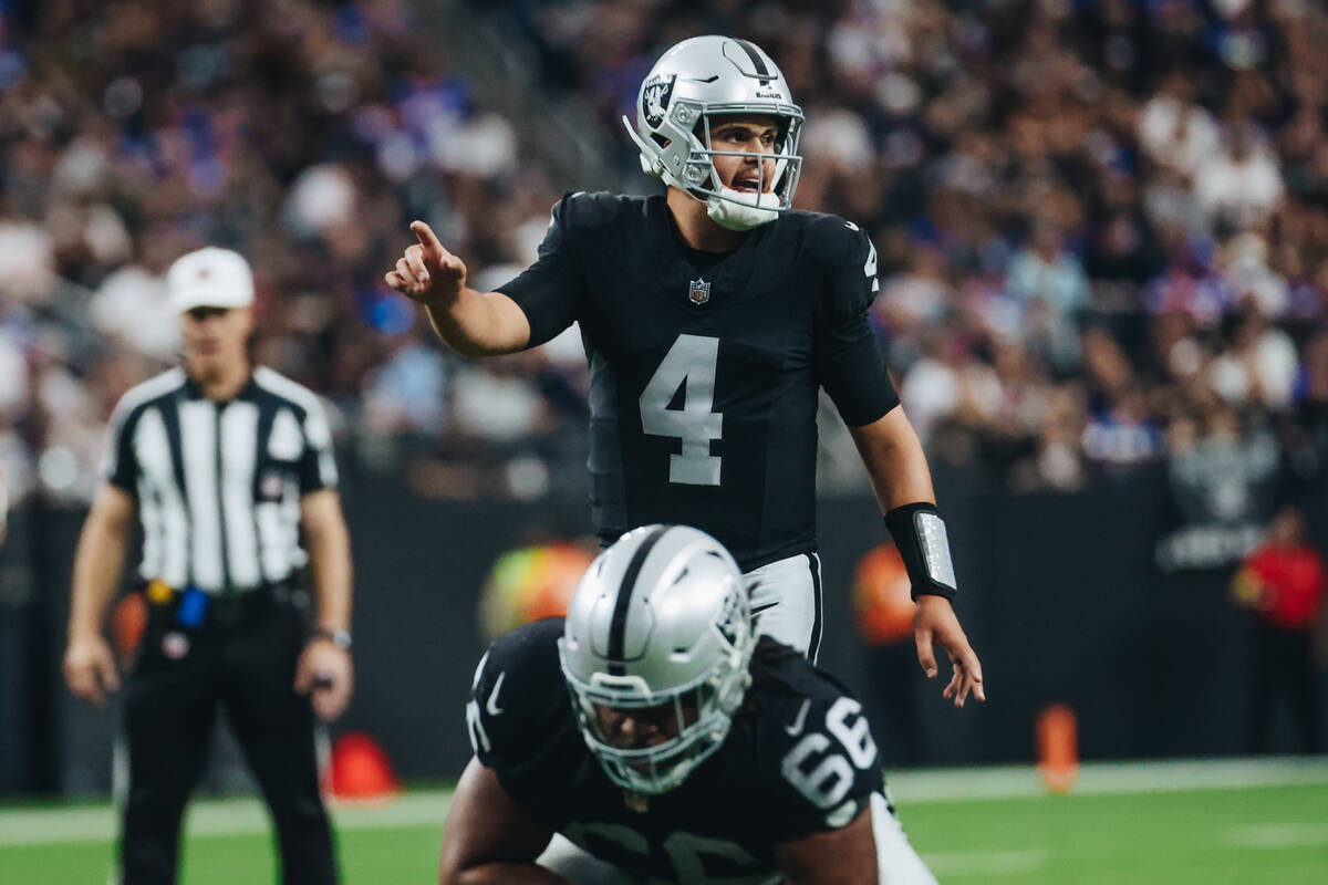 Raiders quarterback Aidan O'Connell (4) yells to his teammates during the first half of a game ...