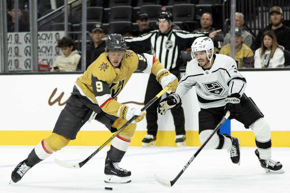 Golden Knights center Jack Eichel (9) skates with the puck against Kings defenseman Matt Roy (3 ...