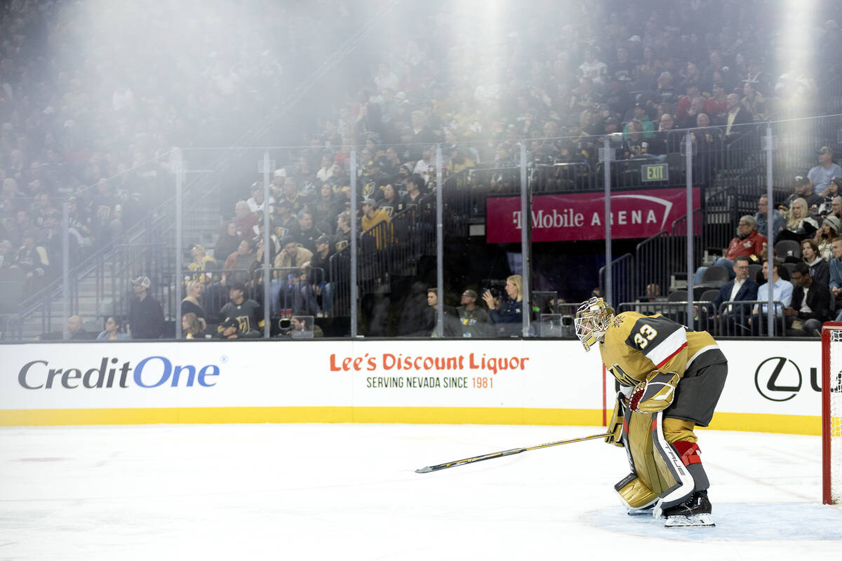 Golden Knights goaltender Adin Hill (33) taps the ice with his stick while his team is on a pow ...