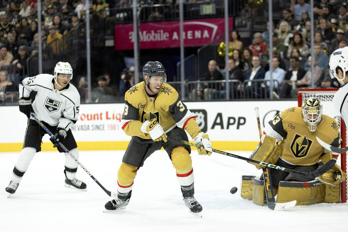 Golden Knights defenseman Brayden McNabb (3) reaches to block a shot while Knights goaltender A ...